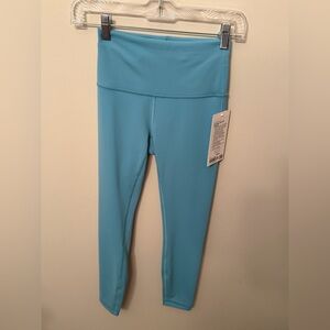 NWT Wunder Train 25” Inseam in Washed Blue